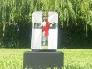a headstone with jesus on a cross